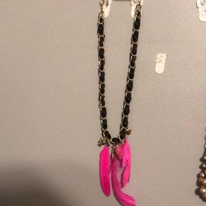 Attention grabber necklace with feathers & charms